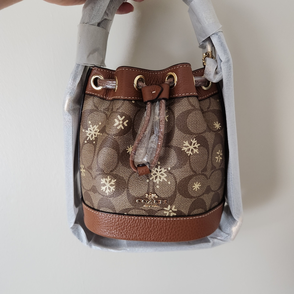 Coach Dempsey Drawstring Bucket Bag 15 In Signature Canvas With Snowflake Print